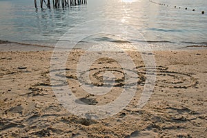 Word Ã¢â¬Å SOS Ã¢â¬Å Write in sand on the beach